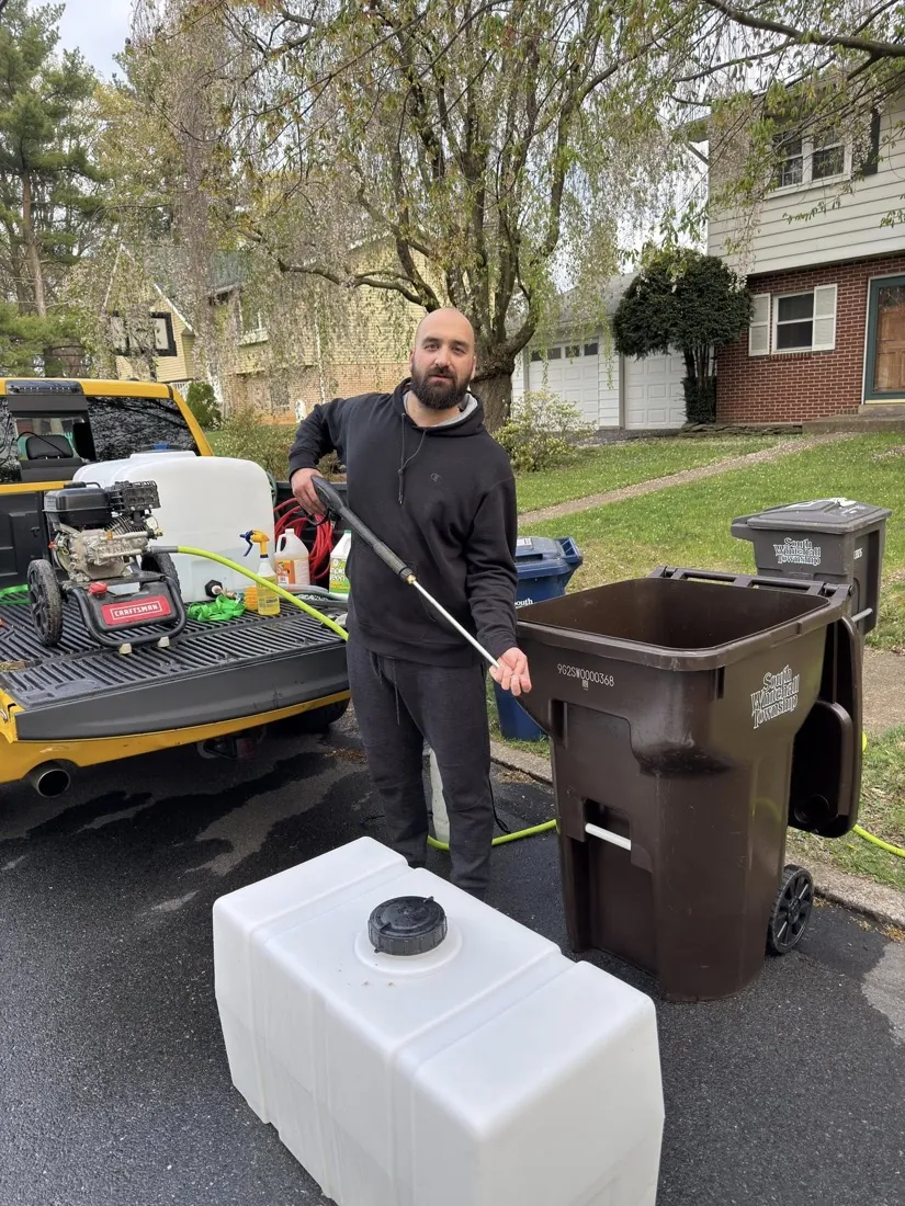 Bin Busters using hot water pressure washing equipment in the Lehigh Valley